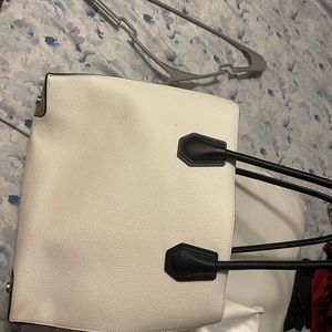 Michael Kors cream colored purse. comes from a pet free smoke free home.